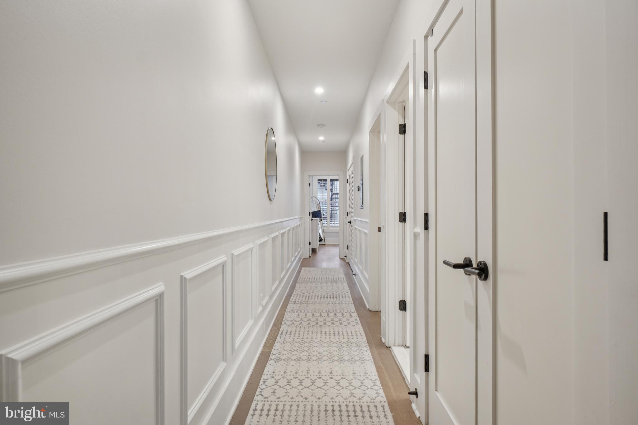 1682 Irving Street Northwest, Unit 2 Washington, DC 20010 - Photo 9 of 25 a view of a hallway with a white walls