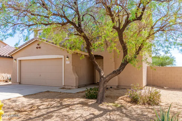 a house with a trees in the background
