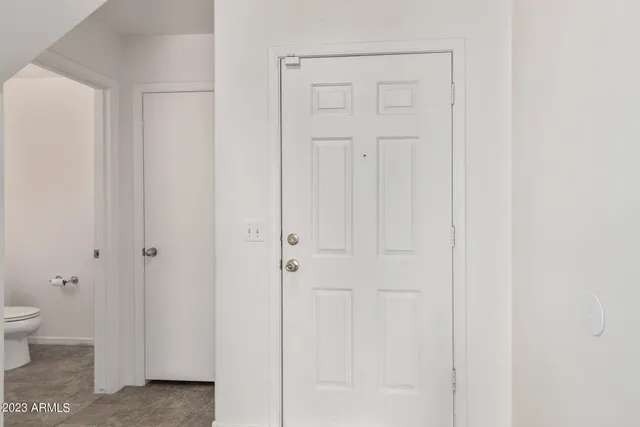 a view of a kitchen with furniture and a window