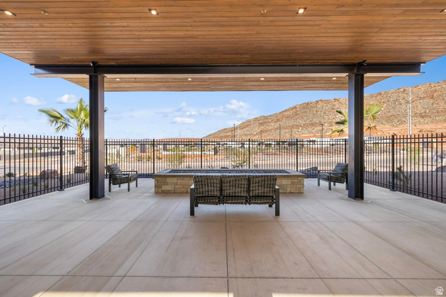 2133 Wolverine Way, Unit 2440 Washington, UT 84780 - Photo 29 of 39 Covered outdoor patio featuring a wood-finish ceiling with recessed lighting