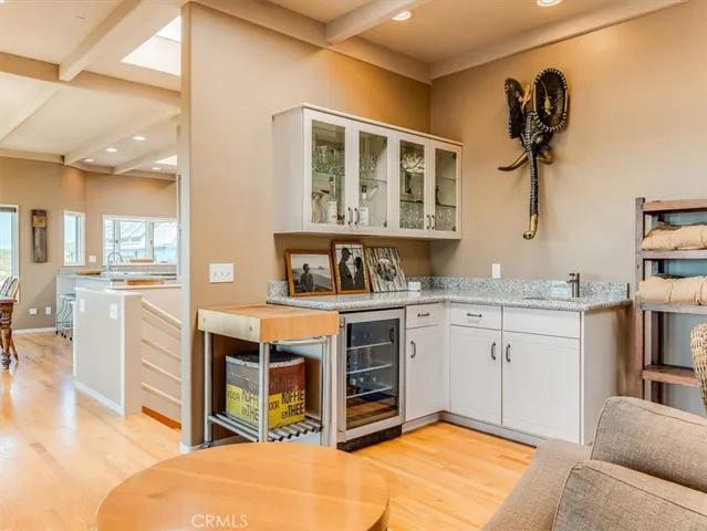 a spacious bedroom with a bed and a chandelier