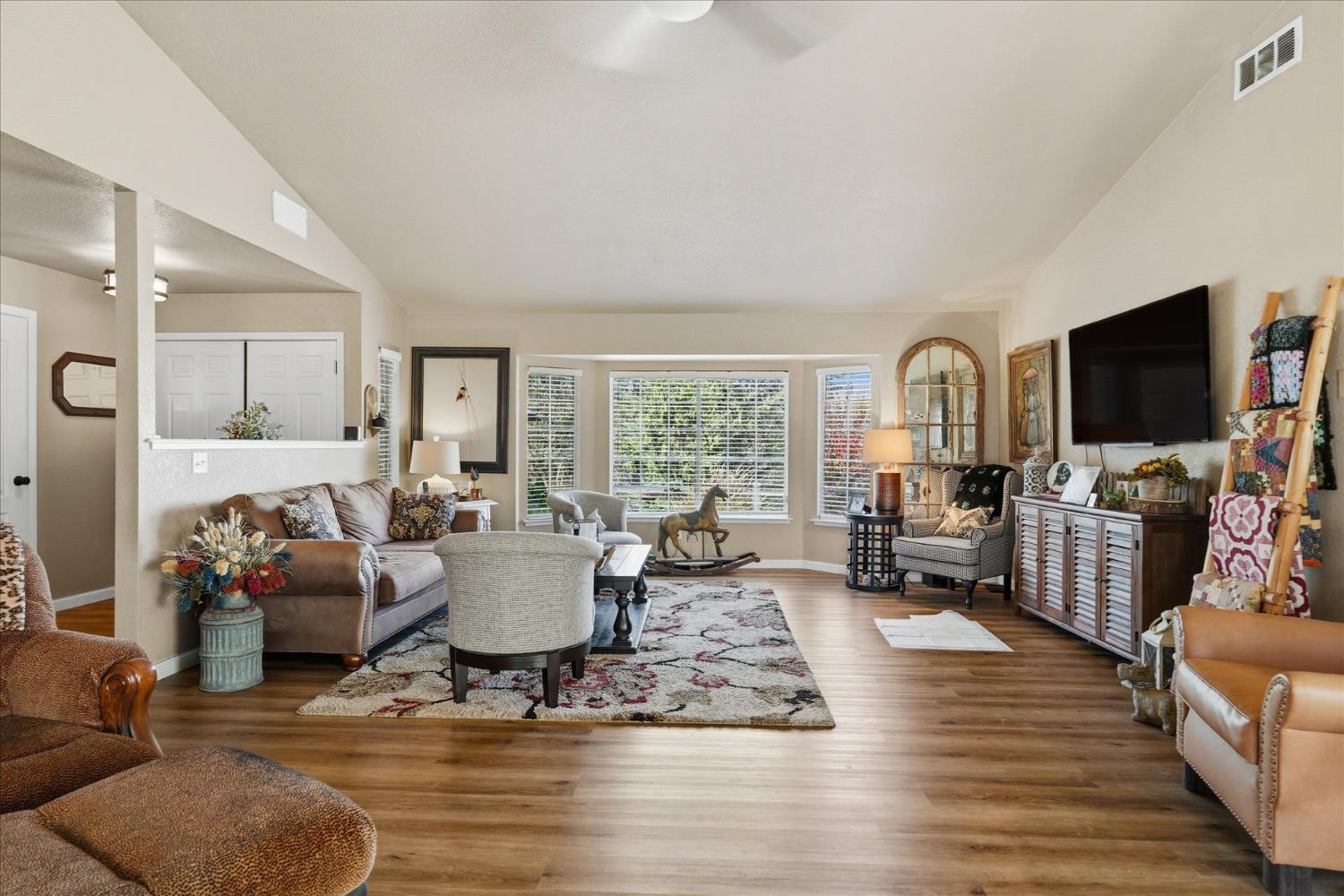 32583 River Knolls Road Coarsegold, CA 93614 - Photo 12 of 63 a living room with furniture or couch and a flat screen tv