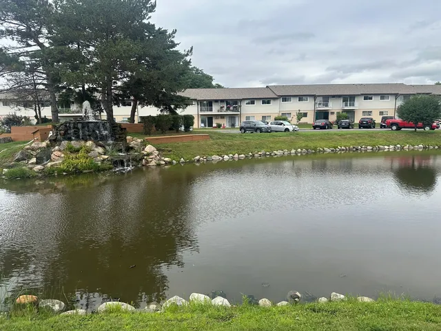 a view of a lake with a building in the background