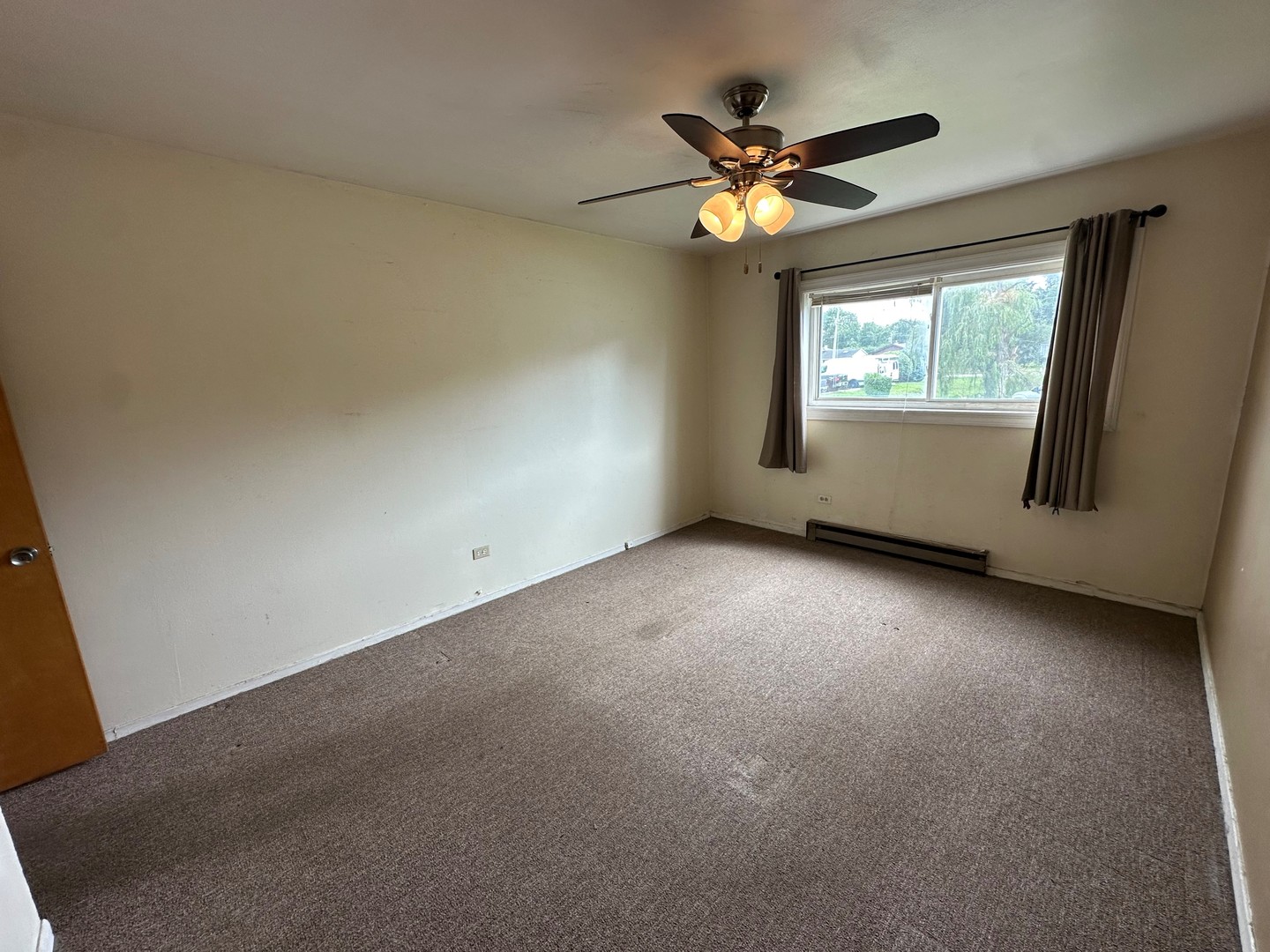 850 East Old Willow Road, Unit 108 Prospect Heights, IL 60070 - Photo 6 of 9 a view of room with window and ceiling fan