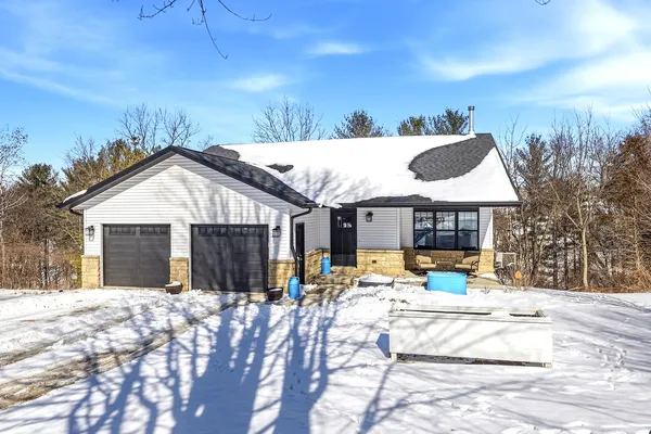 a view of a house with snow on the floor