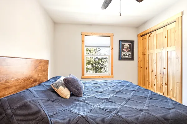 a bedroom with a bed and window