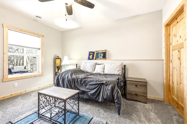 a bedroom with furniture and a window