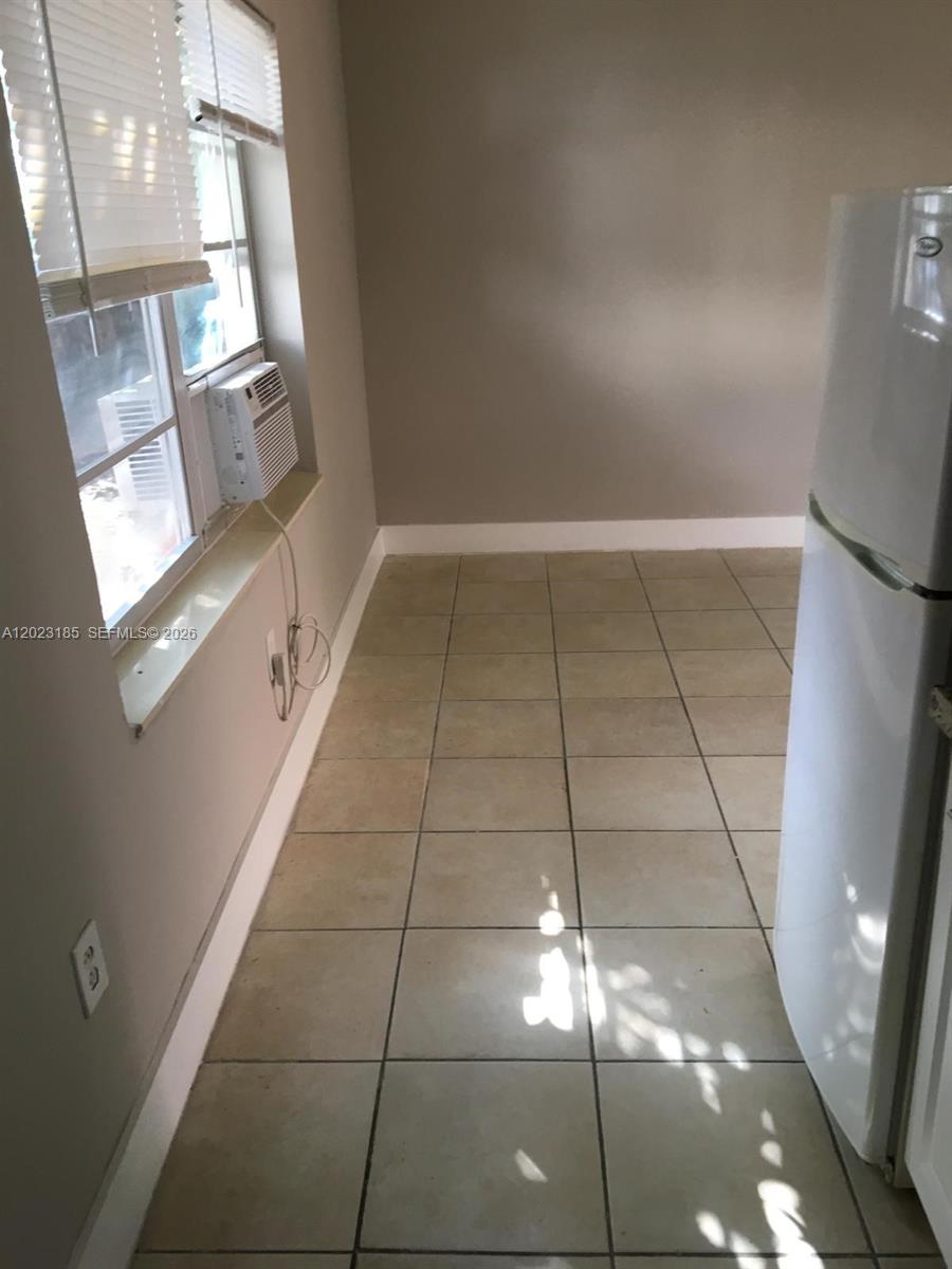 520 Southwest 4th Street, Unit 4 Miami, FL 33130 - Photo 11 of 12 a view of empty room with windows