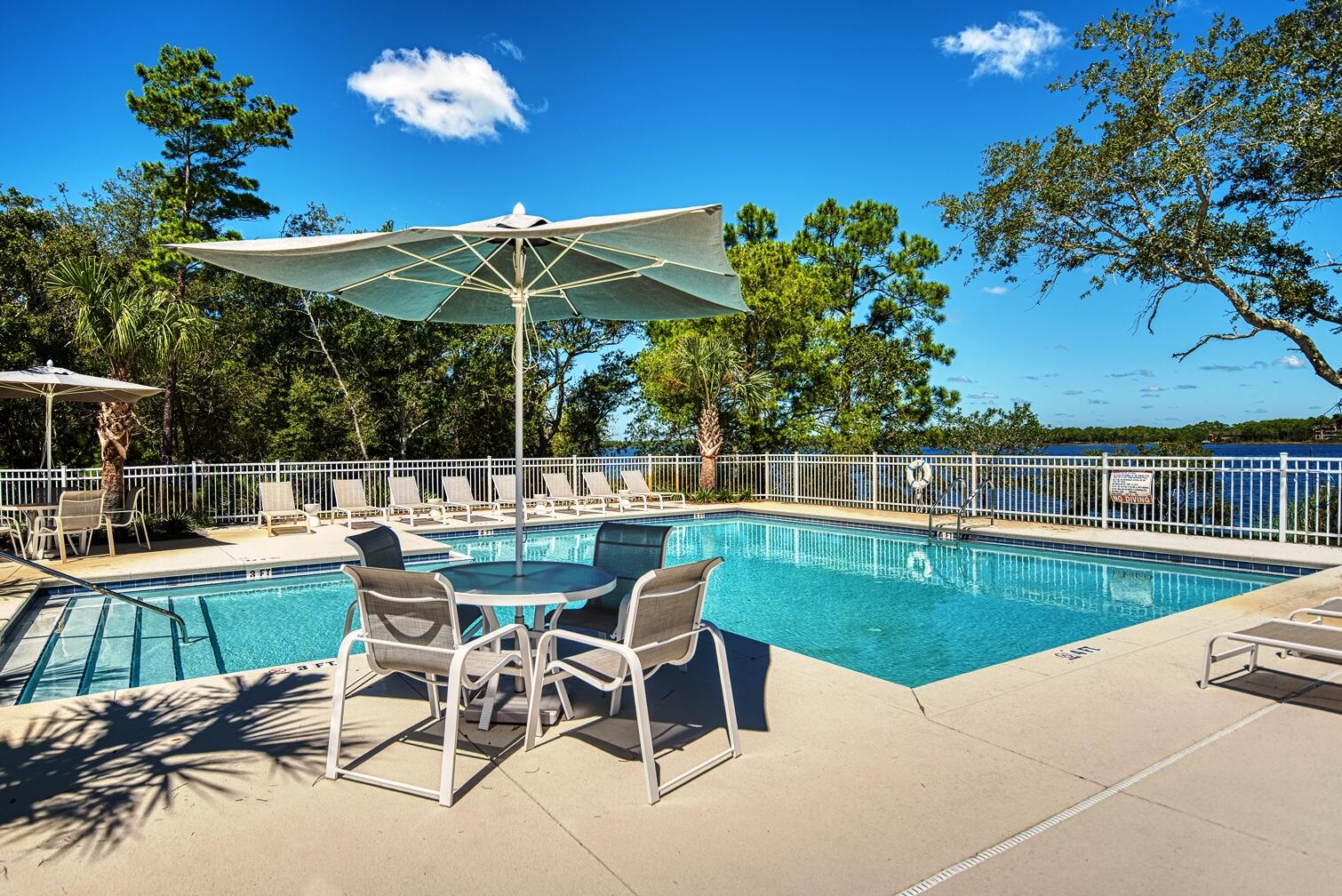 22958 Ann Miller Road Panama City Beach, FL 32413 - Photo 12 of 29 a view of a chairs and table in the patio