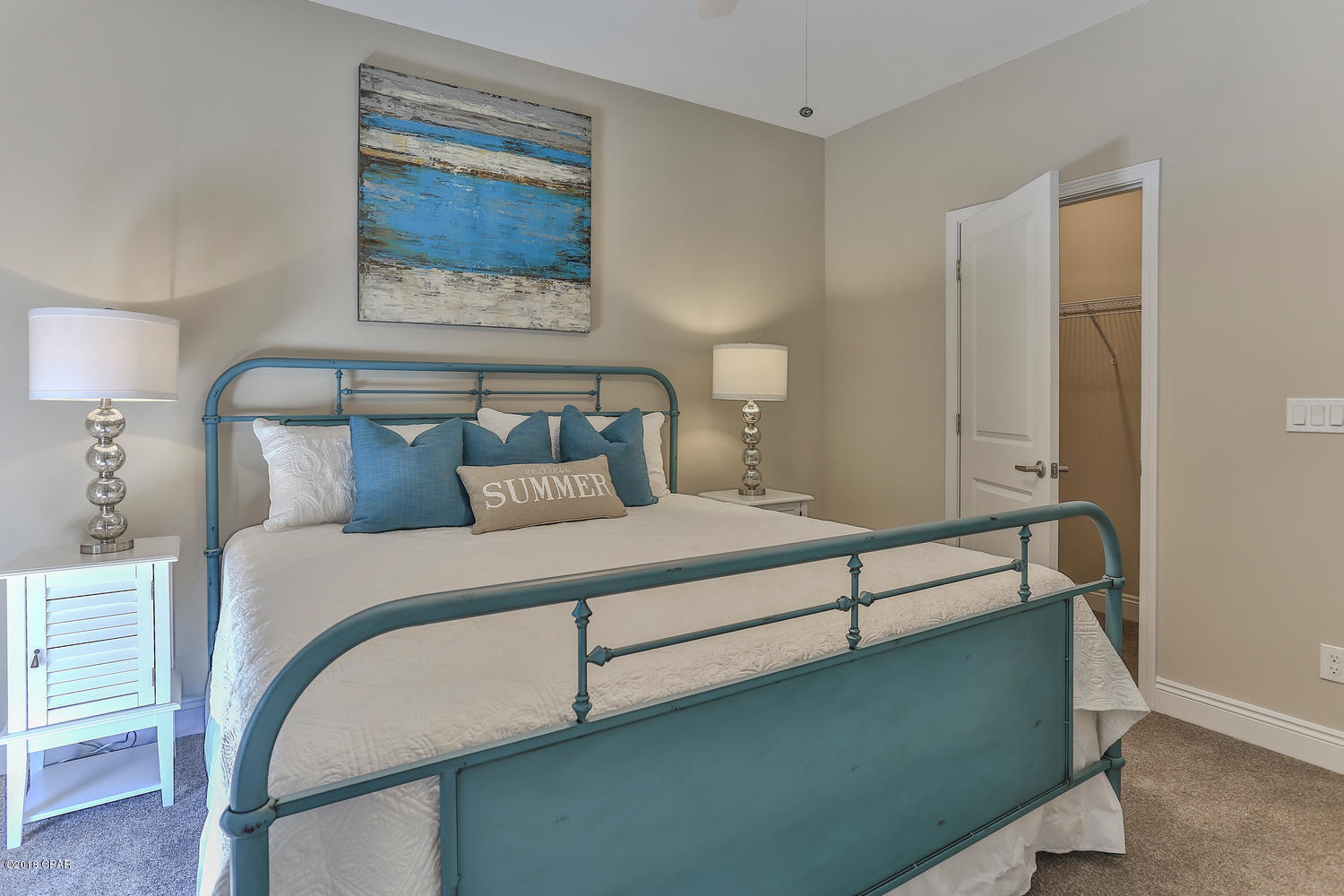 22958 Ann Miller Road Panama City Beach, FL 32413 - Photo 15 of 29 a bedroom with a bed and a painting on the wall
