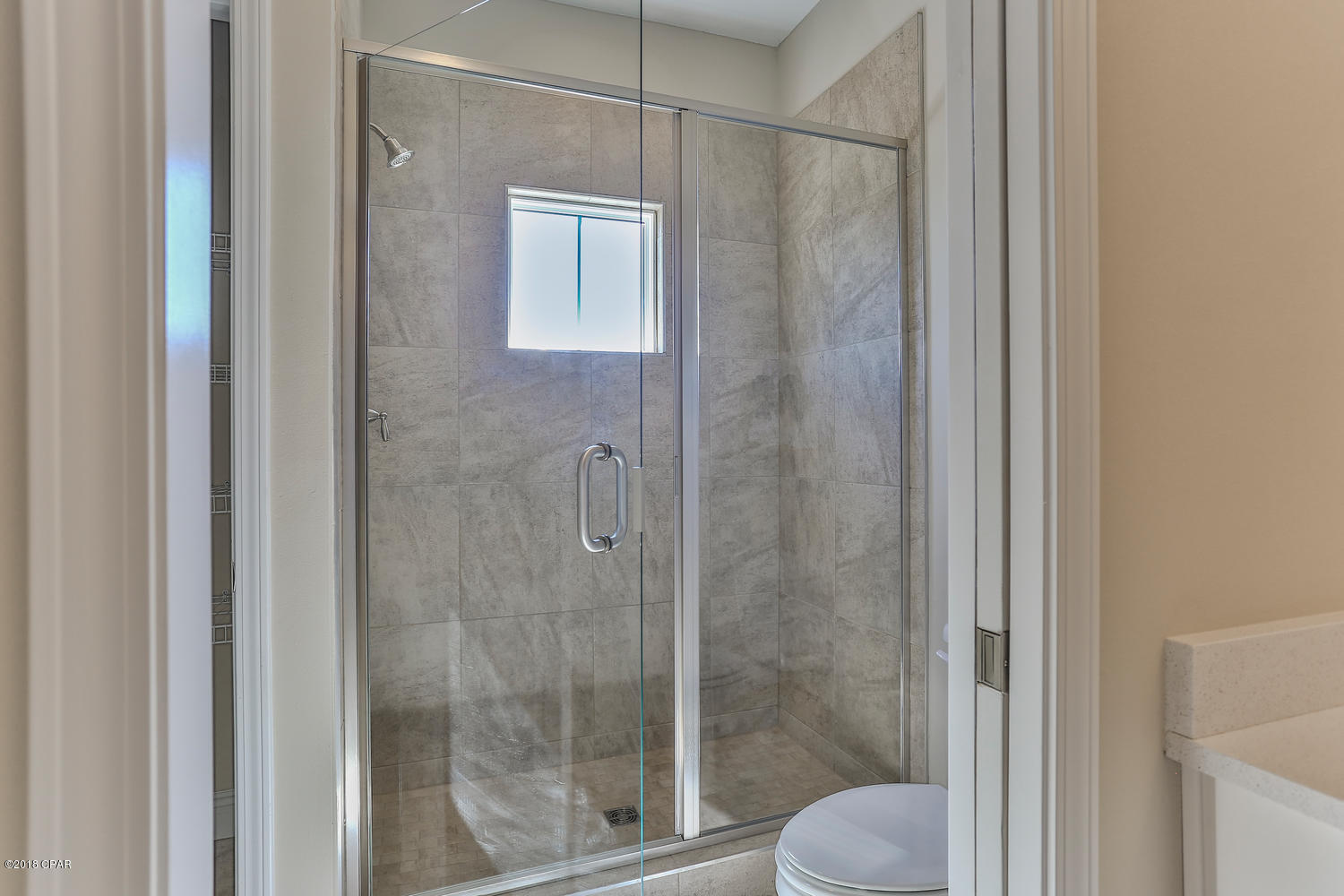22958 Ann Miller Road Panama City Beach, FL 32413 - Photo 23 of 29 a bathroom with a shower and toilet
