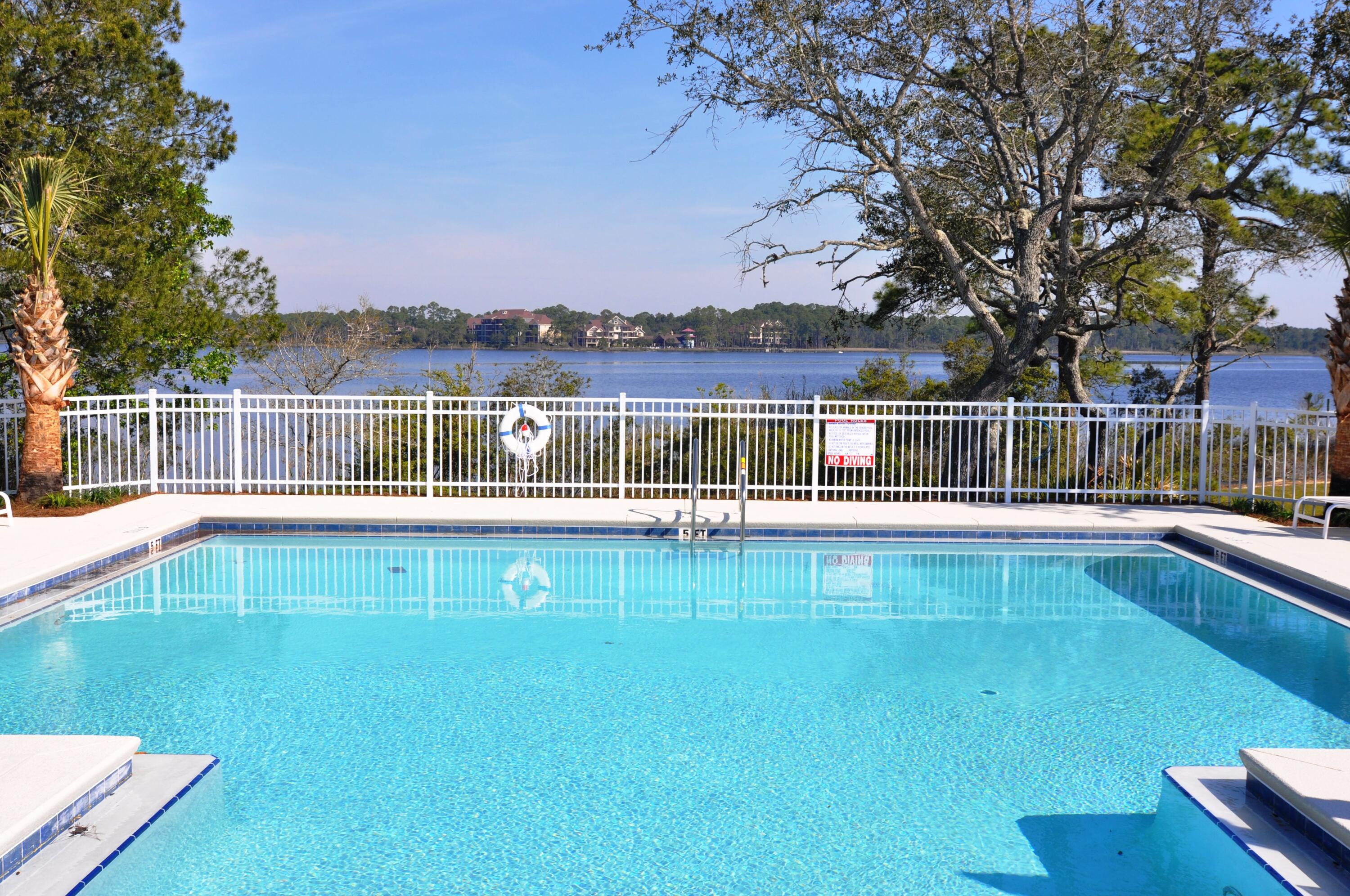 22958 Ann Miller Road Panama City Beach, FL 32413 - Photo 4 of 29 a view of a swimming pool with a lake view