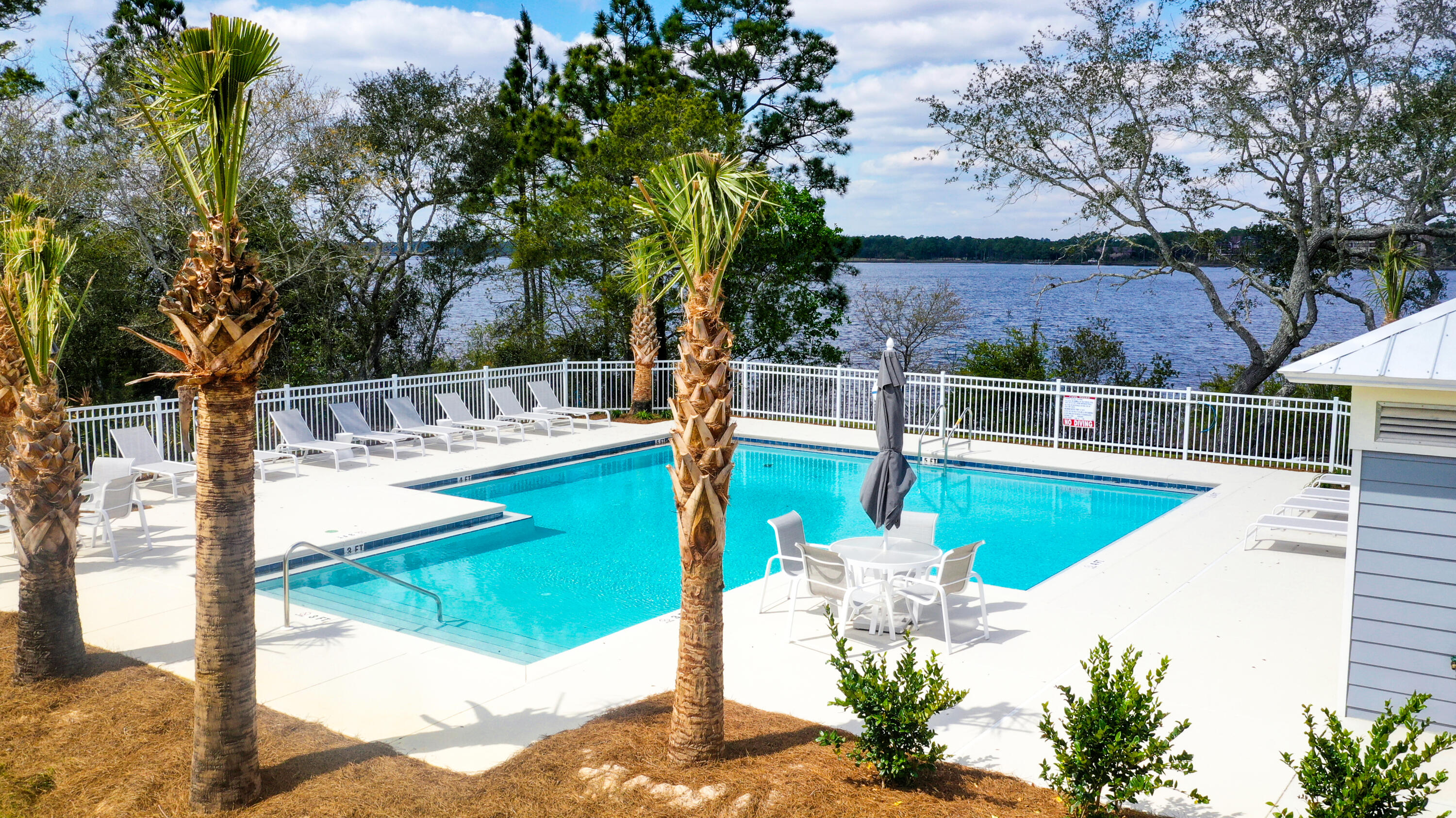 22958 Ann Miller Road Panama City Beach, FL 32413 - Photo 6 of 29 a view of a swimming pool with a patio