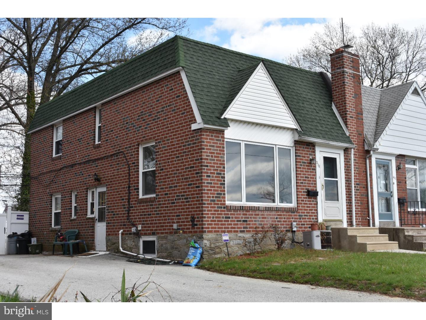 419 W Road Ridley Park, PA 19078 - Photo 1 of 22 a front view of a house with garden