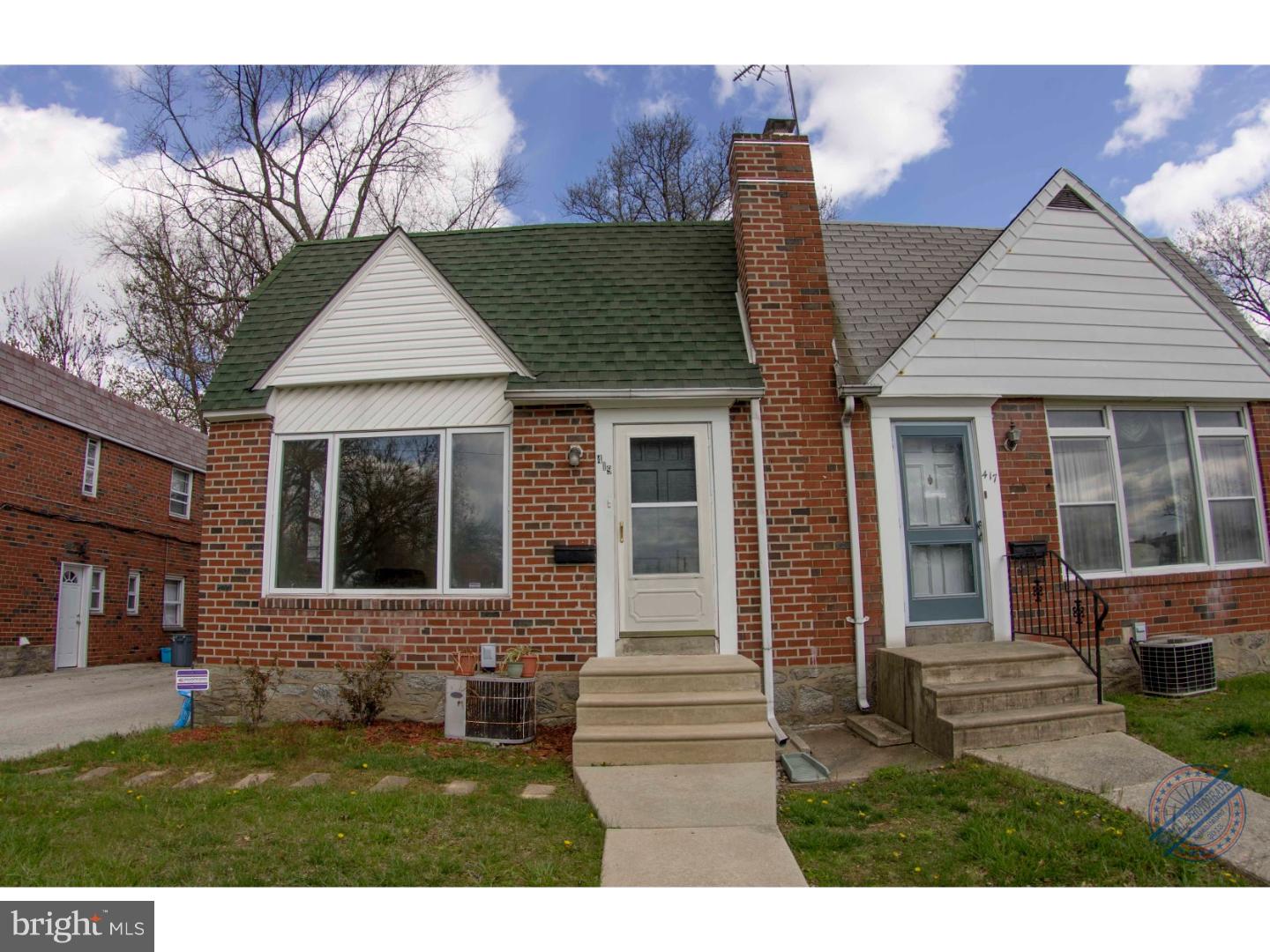 419 W Road Ridley Park, PA 19078 - Photo 2 of 22 a front view of a house with a garden and yard