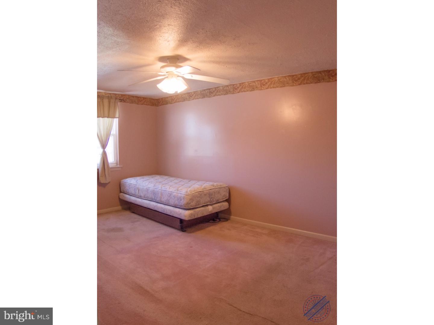 419 W Road Ridley Park, PA 19078 - Photo 13 of 22 a room with a lamp and a ceiling fan