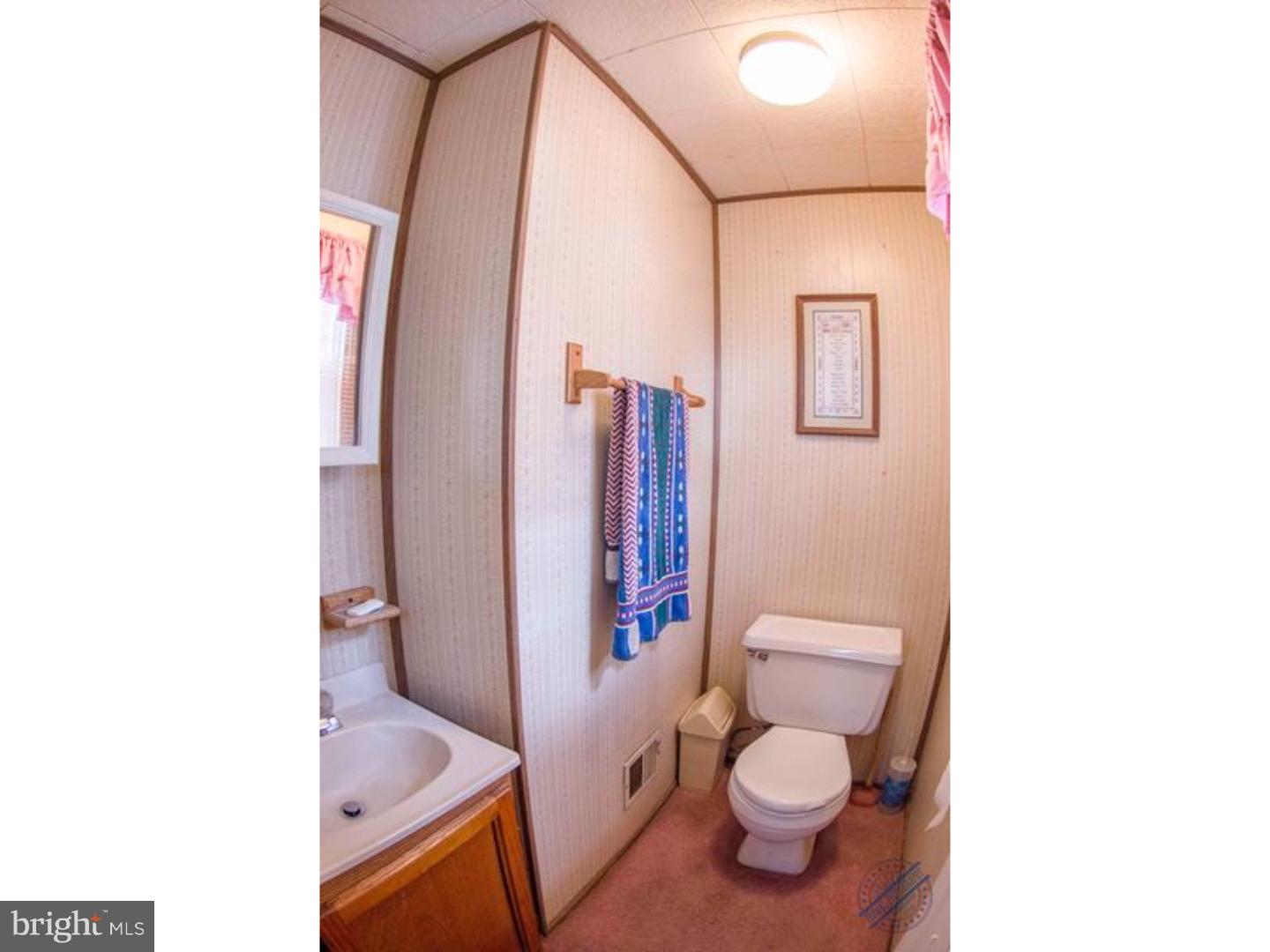419 W Road Ridley Park, PA 19078 - Photo 14 of 22 a bathroom with a toilet and a shower