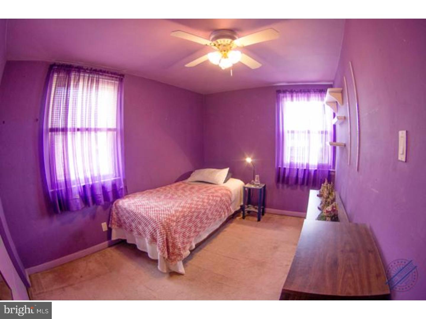 419 W Road Ridley Park, PA 19078 - Photo 15 of 22 a bedroom with a bed and a chandelier