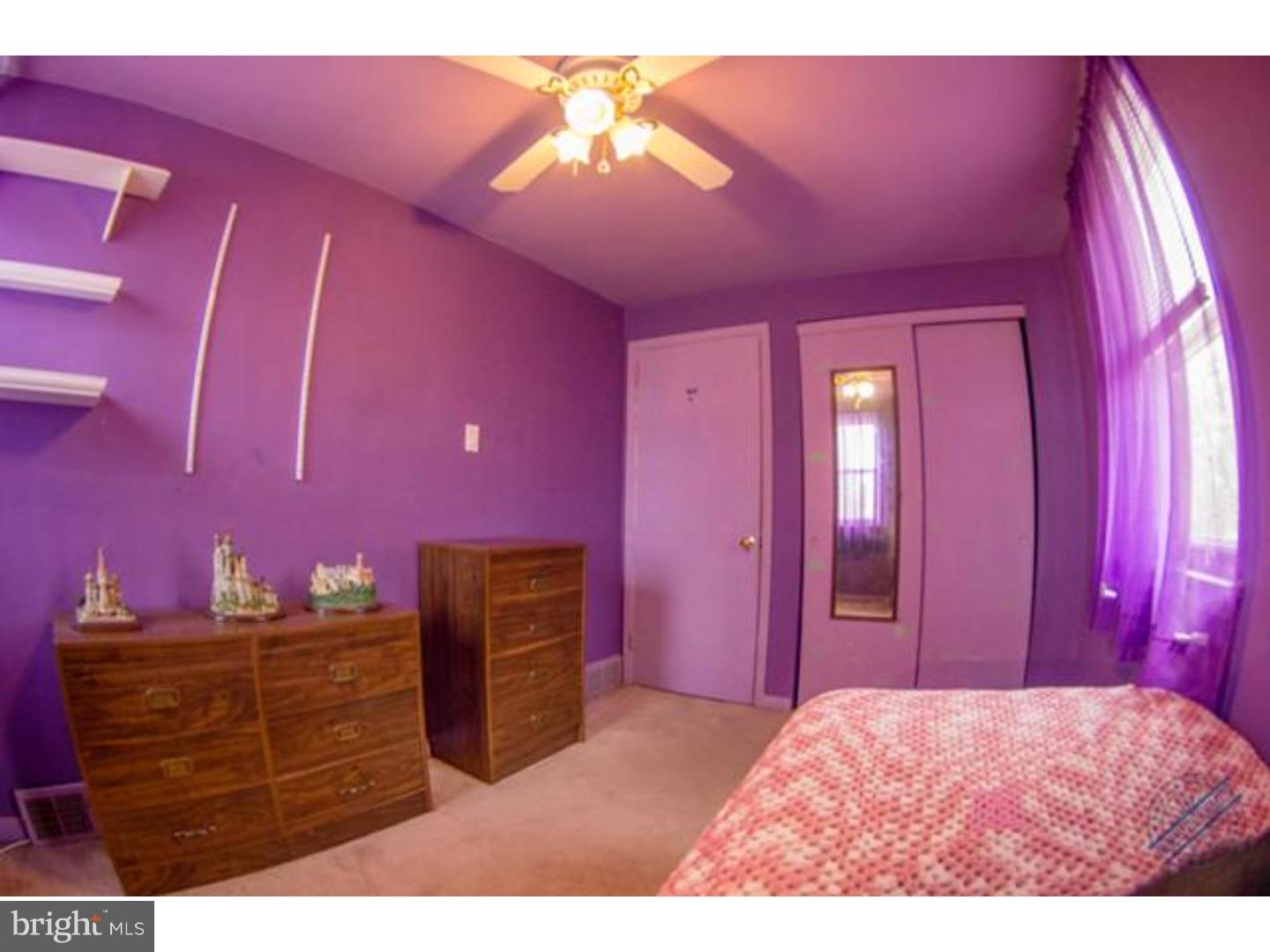 419 W Road Ridley Park, PA 19078 - Photo 16 of 22 a bedroom with a bed and a chandelier