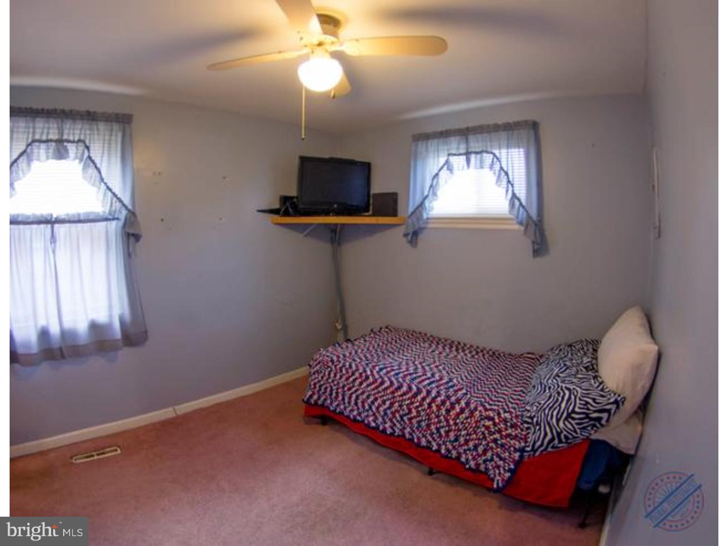 419 W Road Ridley Park, PA 19078 - Photo 17 of 22 a bed room with a bed and a window