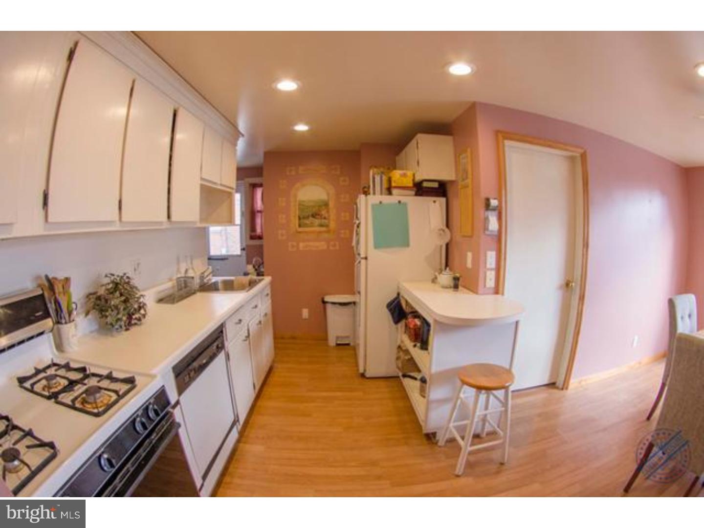 419 W Road Ridley Park, PA 19078 - Photo 6 of 22 a kitchen with a sink and chairs