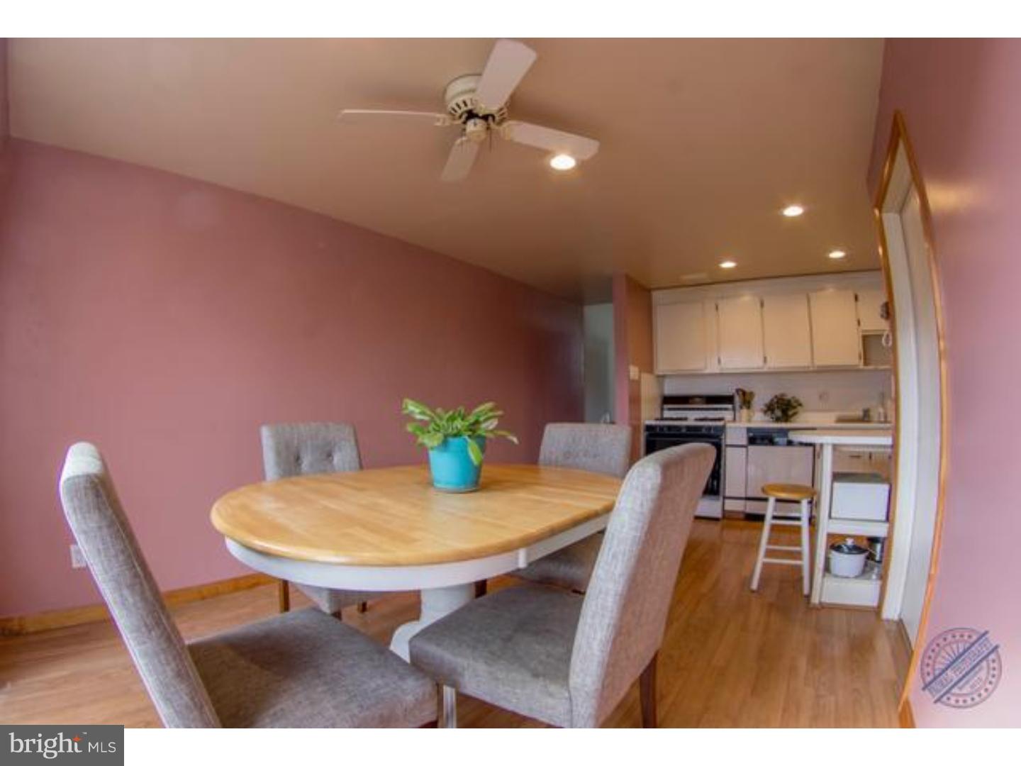 419 W Road Ridley Park, PA 19078 - Photo 7 of 22 a kitchen with stainless steel appliances dining table and chairs