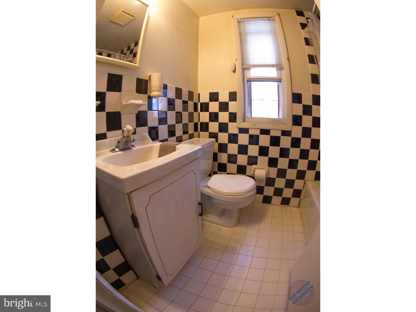 419 W Road Ridley Park, PA 19078 - Photo 10 of 22 a bathroom with a sink toilet and window
