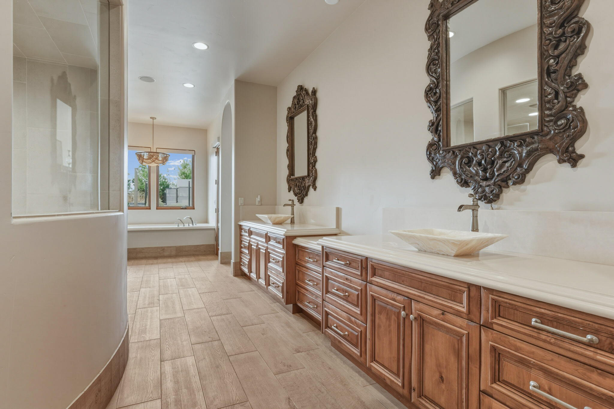 19100 Macalpine Loop Bend, OR 97702 - Photo 24 of 56 Limestone sinks & countertops w/ tile accents
in primary ensuite bathroom