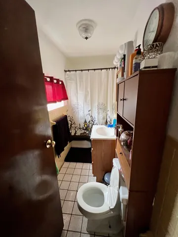 a living room with furniture a rug and a fireplace