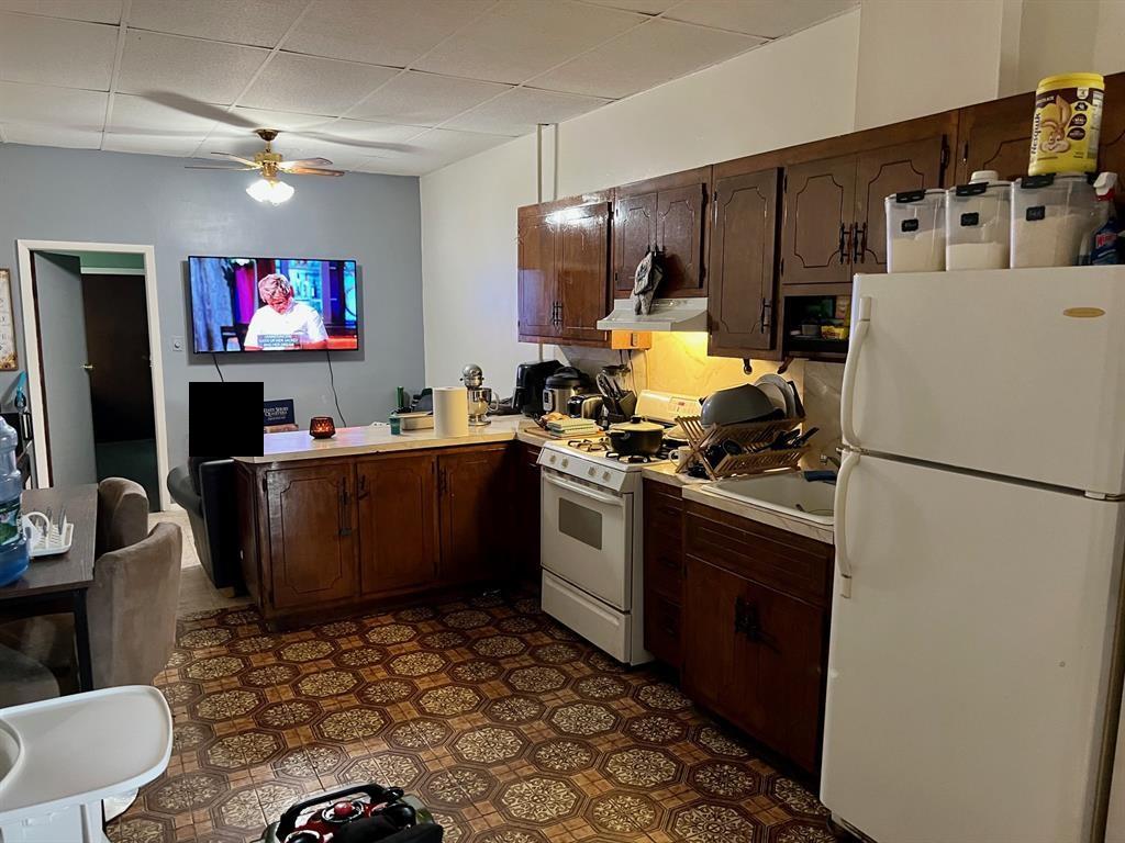 60-85 55th Street Queens, NY 11378 - Photo 8 of 8 a kitchen with stainless steel appliances a stove a refrigerator and a sink