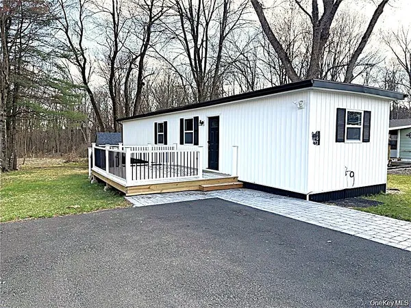 a backyard of a house with a garden and deck