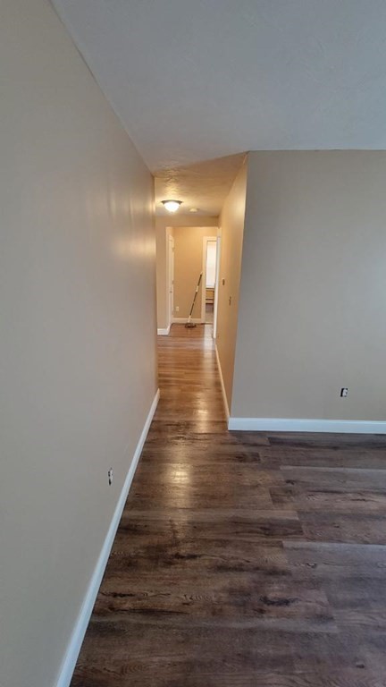75 Pine Street Springfield, MA 01105 - Photo 12 of 40 a view of a hallway with wooden floor