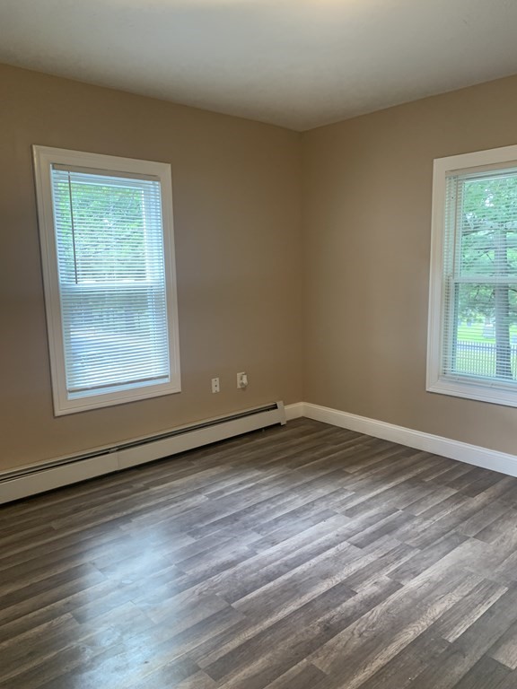 75 Pine Street Springfield, MA 01105 - Photo 36 of 40 a view of an empty room with wooden floor and a window