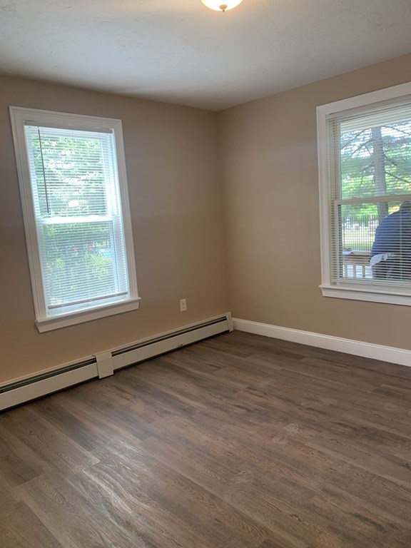 75 Pine Street Springfield, MA 01105 - Photo 38 of 40 an empty room with wooden floor and windows