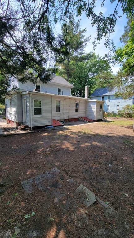 75 Pine Street Springfield, MA 01105 - Photo 5 of 40 a front view of a house with a yard and trees