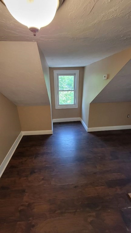 75 Pine Street Springfield, MA 01105 - Photo 8 of 40 a view of room and hall with wooden floor
