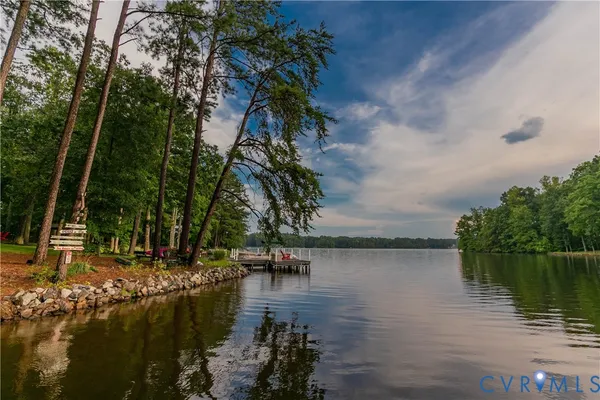 a view of a lake with a wooden bridge and lake view