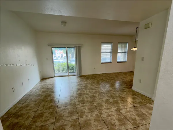 a view of an empty room and window