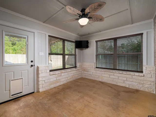 a view of backyard with porch and garden