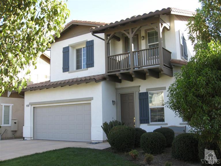 4774 Promenade Street Simi Valley, CA 93063 - Photo 1 of 21 a front view of a house with a garden and plants