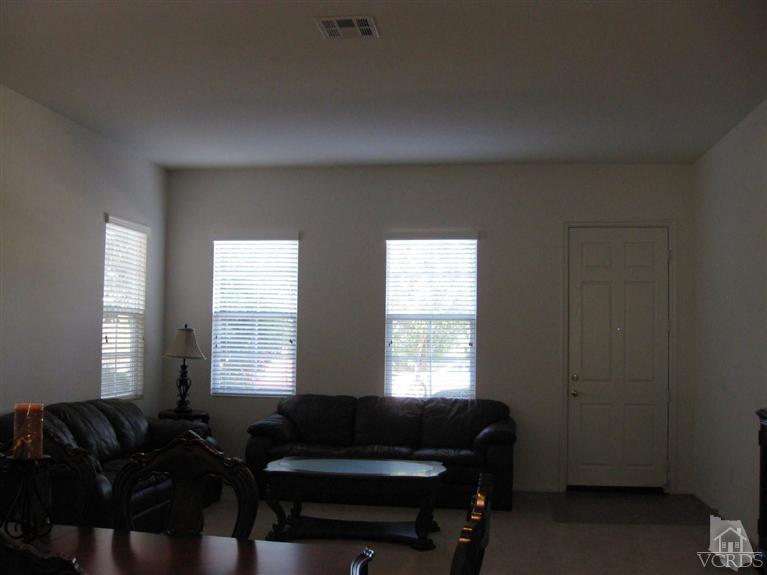 4774 Promenade Street Simi Valley, CA 93063 - Photo 2 of 21 a living room with furniture and a window