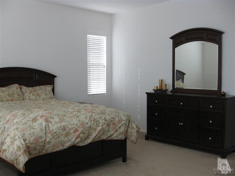 4774 Promenade Street Simi Valley, CA 93063 - Photo 13 of 21 a bedroom with a bed and a dresser