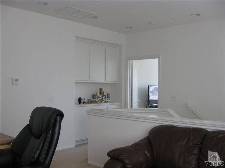 4774 Promenade Street Simi Valley, CA 93063 - Photo 5 of 21 a room with a couch chair and a lamp