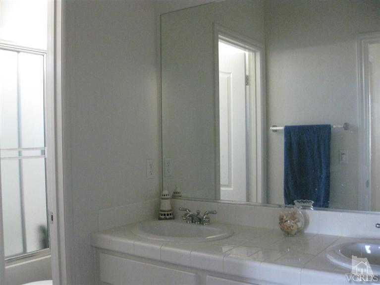 4774 Promenade Street Simi Valley, CA 93063 - Photo 7 of 21 a bathroom with a sink and a mirror