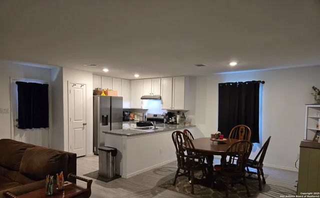 a view of a dining room with furniture