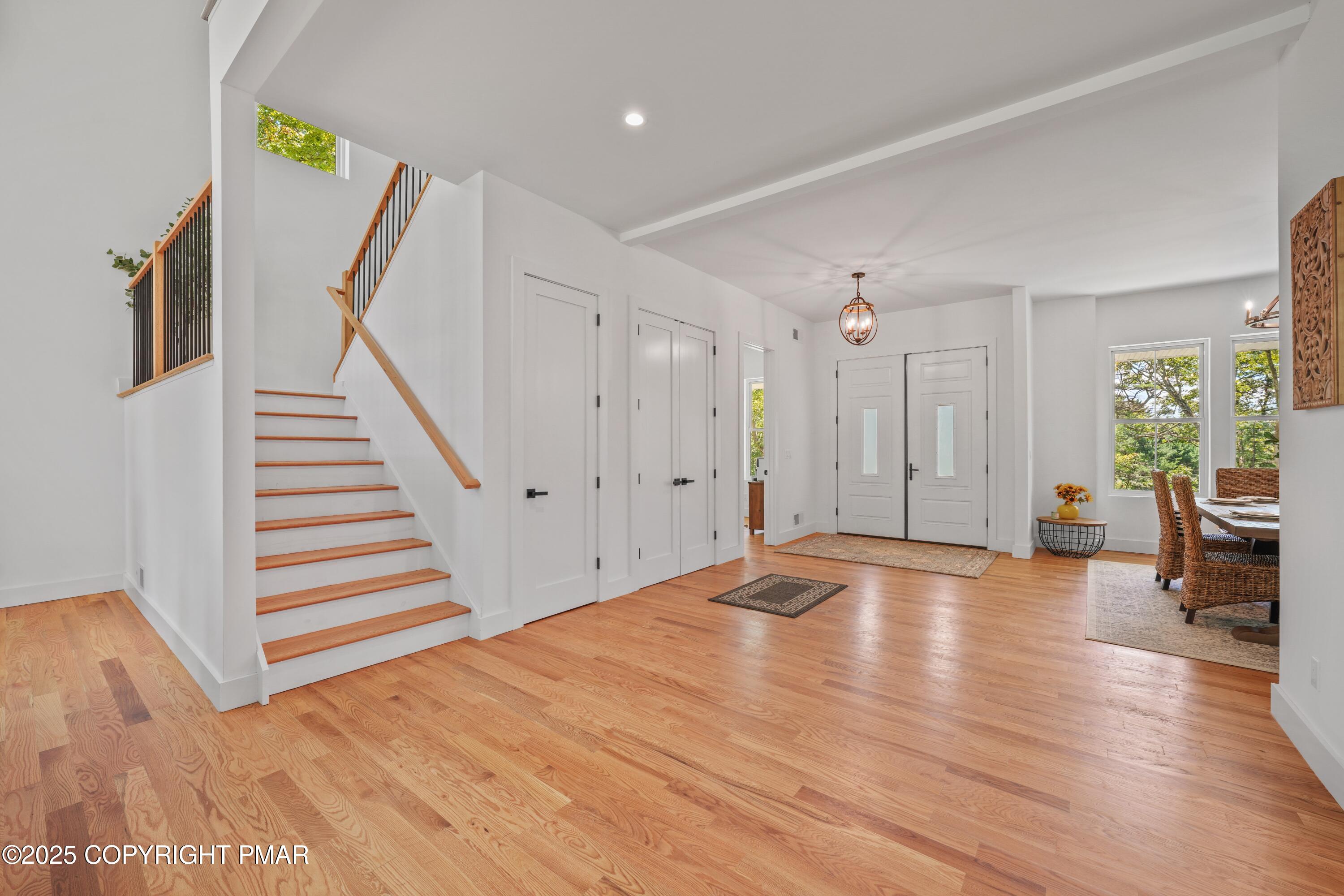 4 Gary Lane Milford, PA 18337 - Photo 23 of 48 a view of empty room with wooden floor and stairs