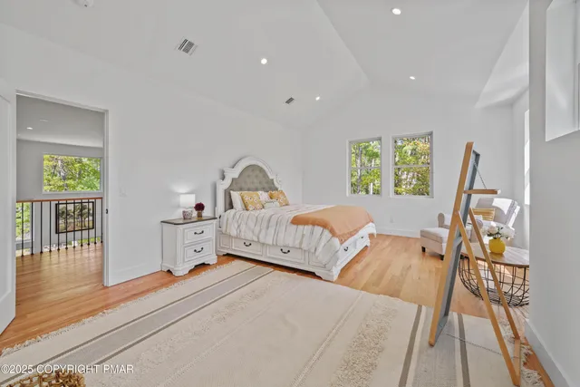 a bathroom with a tub sink and shower