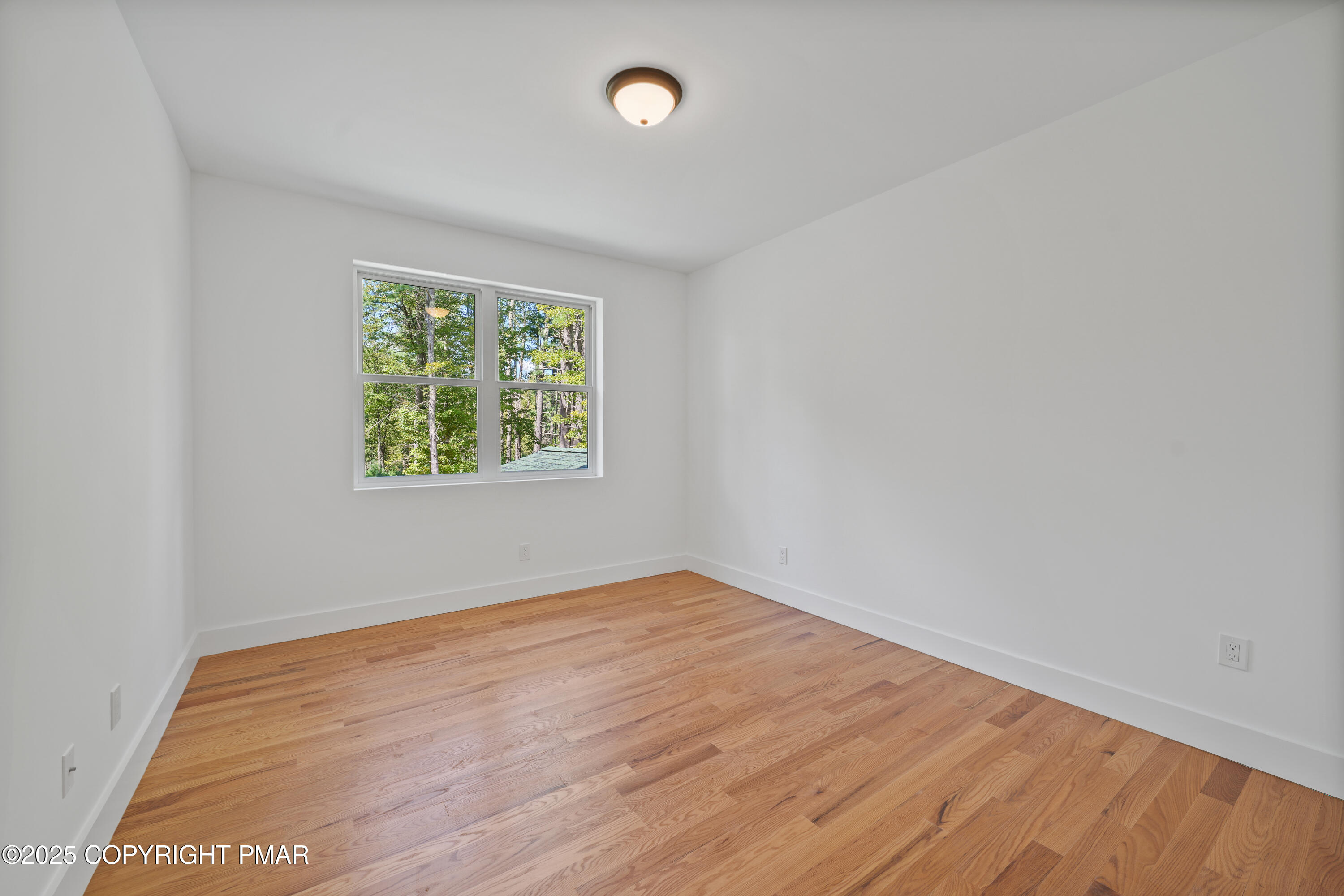 4 Gary Lane Milford, PA 18337 - Photo 40 of 48 an empty room with wooden floor and windows