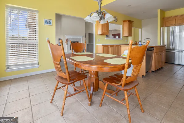 a kitchen with a sink a stove and cabinets
