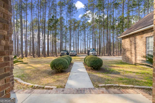 a view of a house and a yard